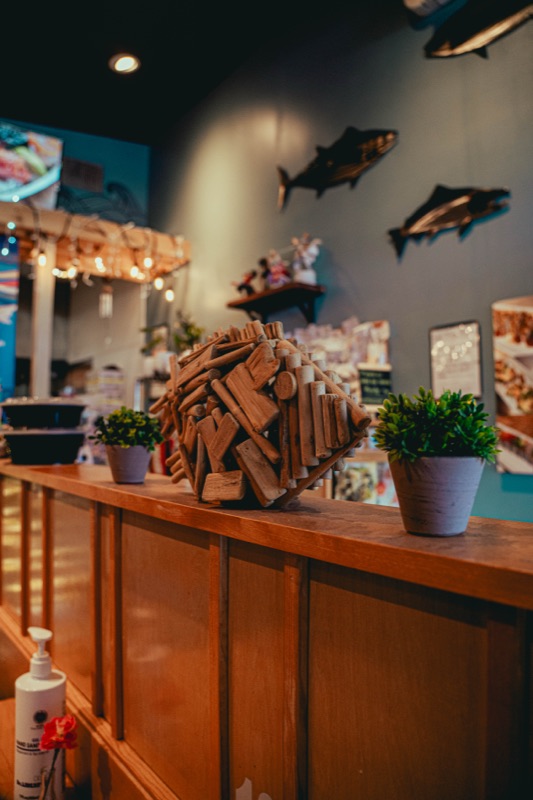 Wooden fish sculpture on the counter